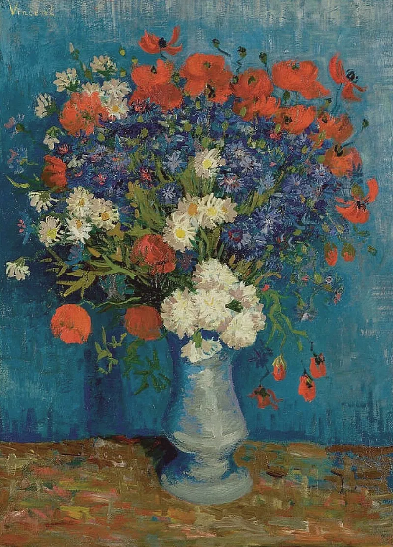 Still life: vase with cornflowers and poppies
